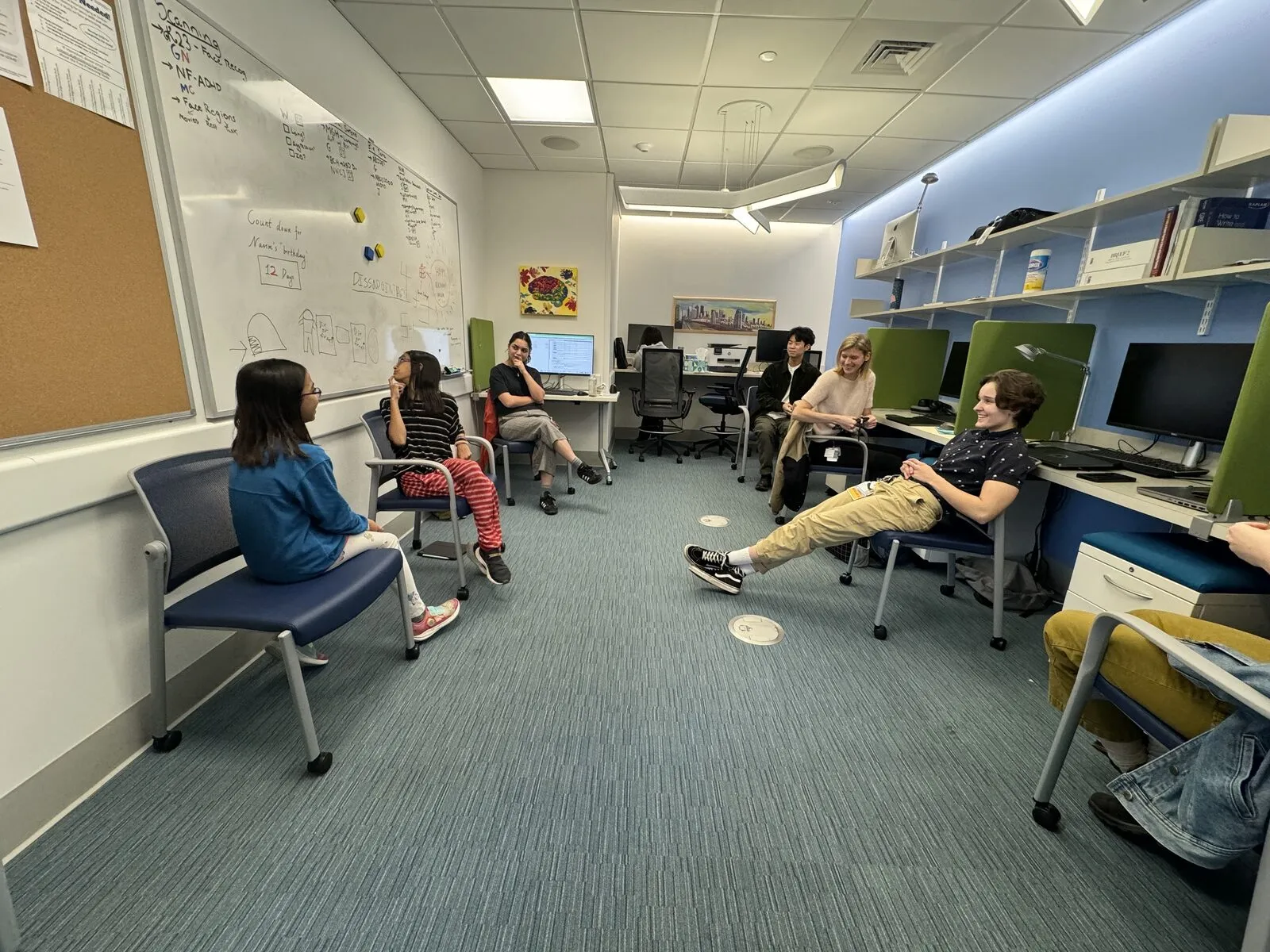 A lab meeting in the office.